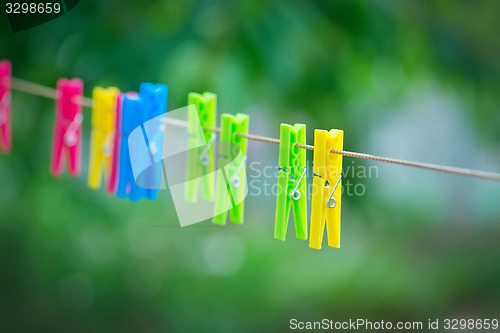 Image of  colored clothespins on rope