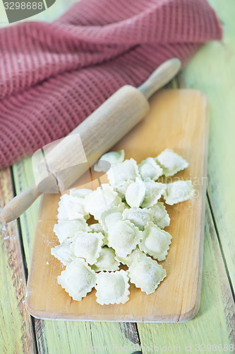 Image of flour and raw ravioli 