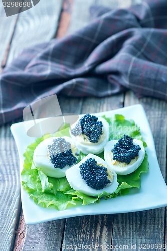Image of boiled eggs with caviar