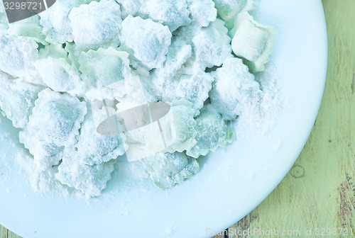 Image of flour and raw ravioli 