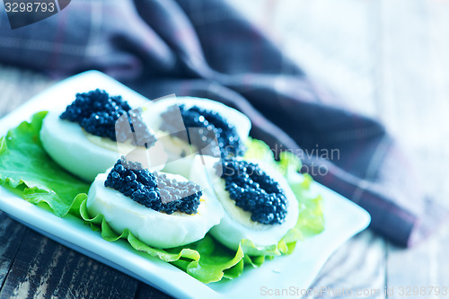 Image of boiled eggs with caviar