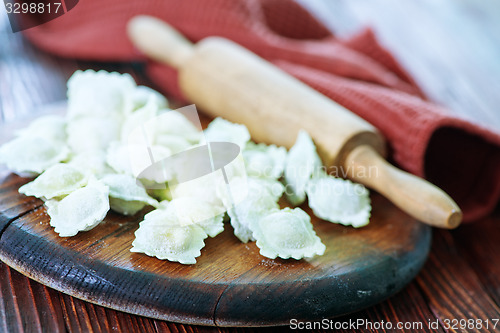 Image of flour and raw ravioli 