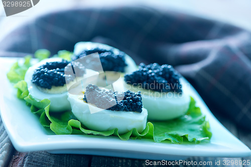 Image of boiled eggs with caviar