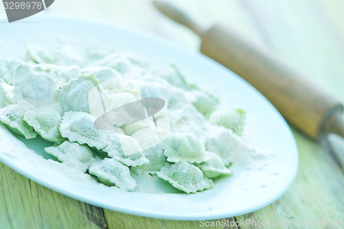 Image of flour and raw ravioli 