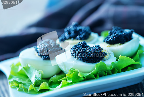 Image of boiled eggs with caviar