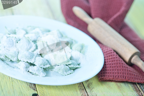 Image of flour and raw ravioli 