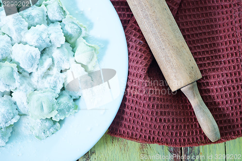 Image of flour and raw ravioli 