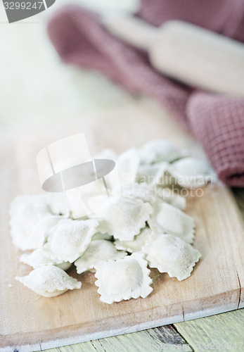 Image of flour and raw ravioli 