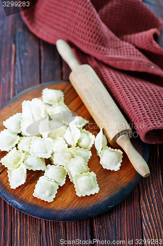 Image of flour and raw ravioli 