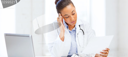 Image of female doctor with laptop pc