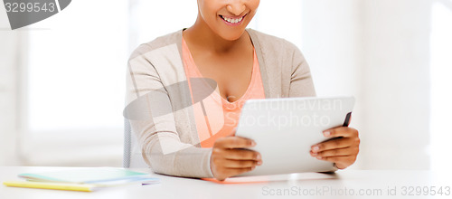 Image of smiling student girl with tablet pc