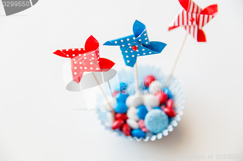 Image of candies with pinwheel toys on independence day