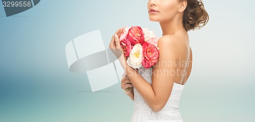 Image of bride or woman with bouquet of flowers