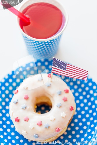 Image of donut with juice and american flag decoration