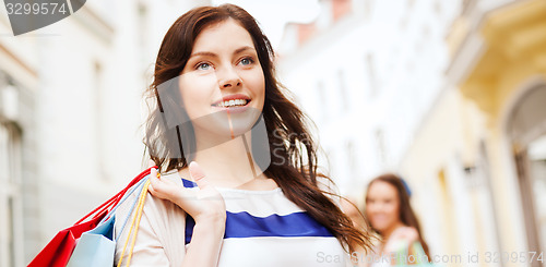 Image of woman with shopping bags in ctiy