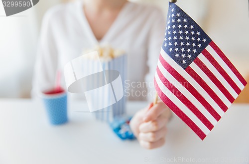 Image of close up of woman holding american flag