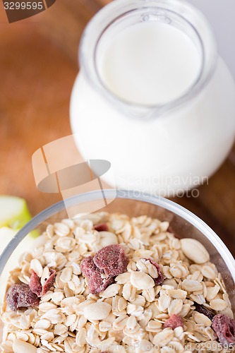 Image of close up of bowl with granola or muesli on table