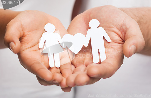 Image of couple hands with paper couple