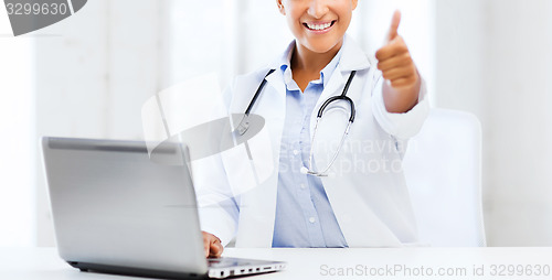 Image of female doctor with laptop pc