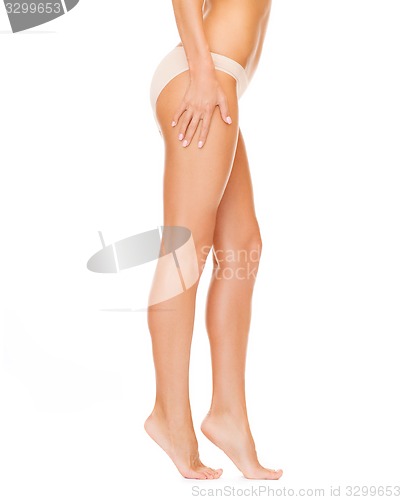 Image of woman with long legs in cotton underwear