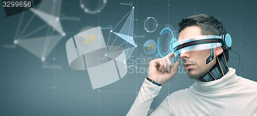 Image of man with futuristic 3d glasses and sensors