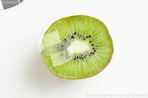 Image of close up of ripe kiwi slice on table