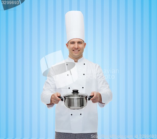 Image of happy male chef cook holding pot