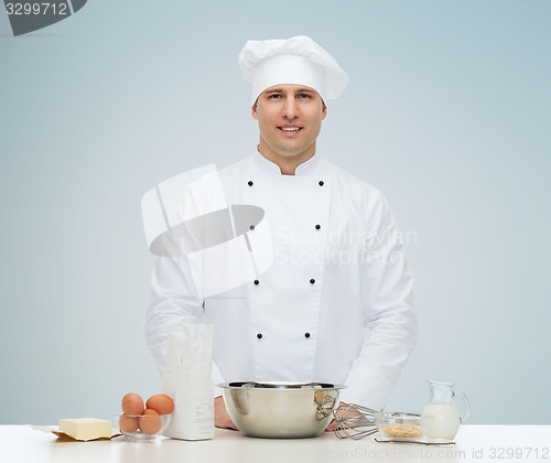 Image of happy male chef cook baking