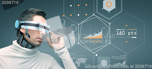 Image of man with futuristic 3d glasses and sensors