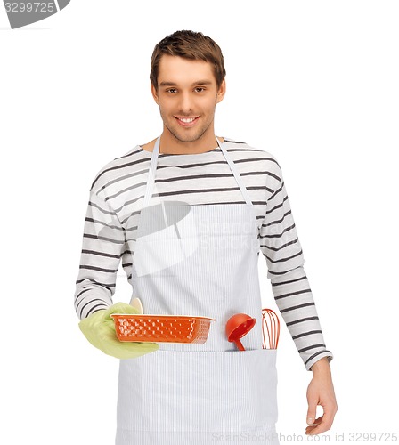 Image of happy man or cook with baking and kitchenware