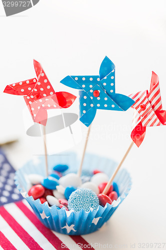 Image of candies with pinwheel toys on independence day