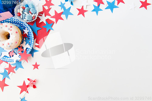 Image of donut with candies and stars on independence day