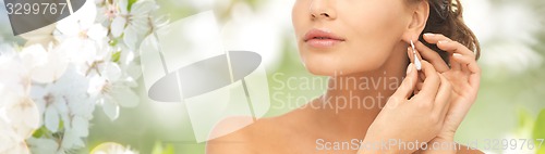 Image of woman with diamond earrings