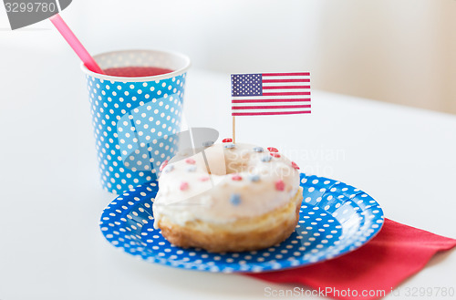 Image of donut with juice and american flag decoration