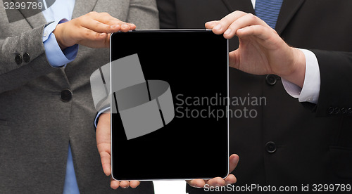 Image of businessman and businesswoman with tablet pc