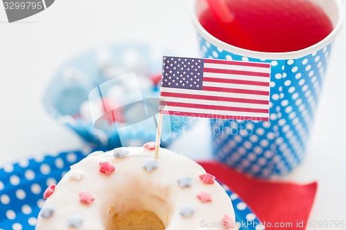 Image of donut with juice and candies on independence day