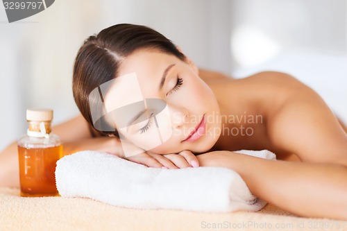 Image of happy woman in spa salon