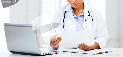 Image of female doctor with laptop pc