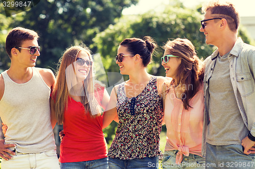 Image of group of smiling friends outdoors
