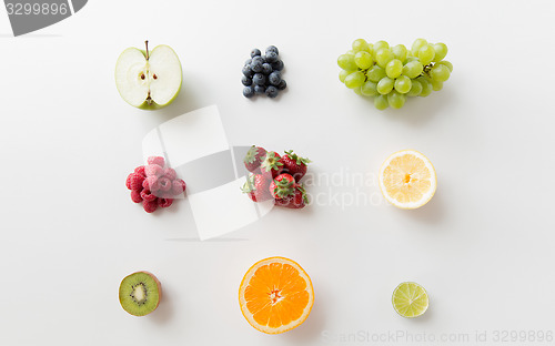 Image of ripe fruits and berries on white surface