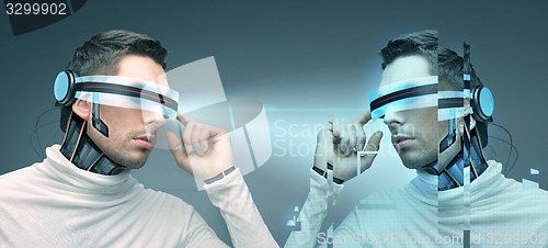 Image of man with futuristic 3d glasses and sensors