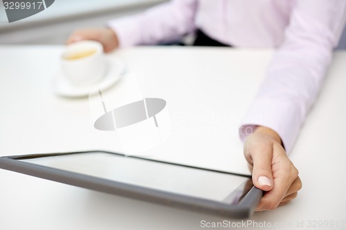 Image of close up of businesswoman hands with tablet pc