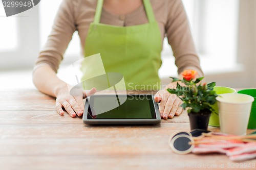 Image of close up of woman or gardener with tablet pc