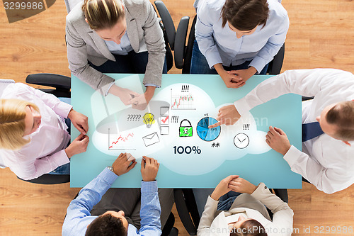 Image of close up of business team sitting at table