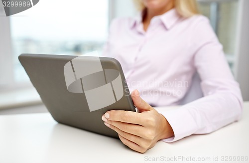 Image of close up of businesswoman hands with tablet pc