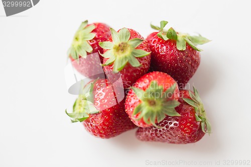 Image of juicy fresh ripe red strawberries on white