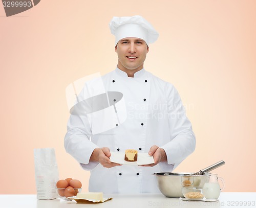 Image of happy male chef cook baking