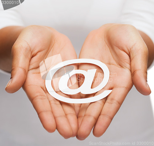 Image of womans cupped hands showing e-mail cutout sign