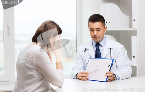 Image of doctor and young woman meeting at hospital