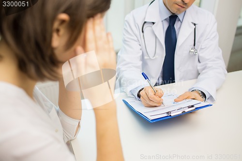 Image of close up of doctor and woman meeting at hospital